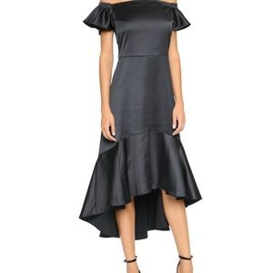 EDIT off shoulder black dress. Button closure.